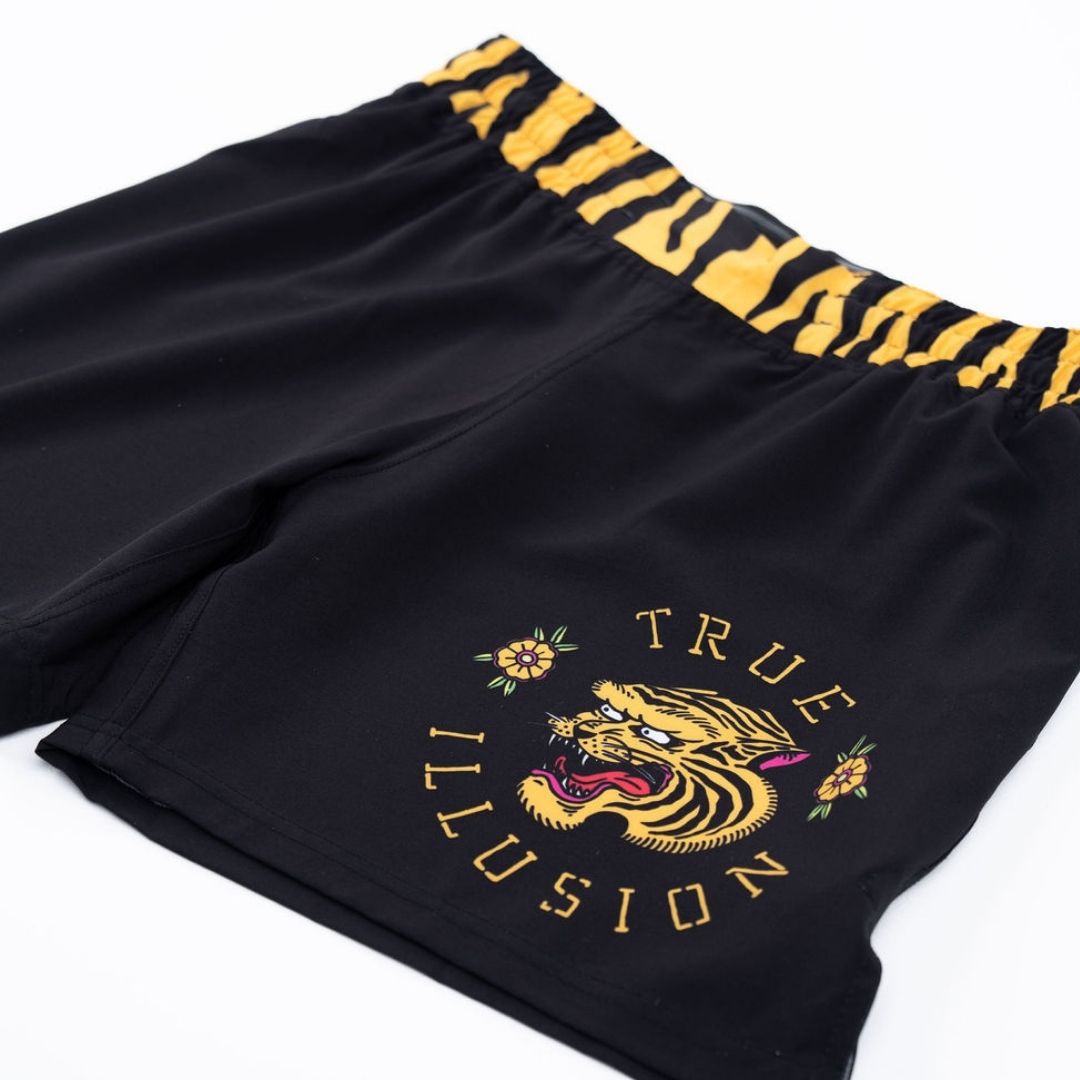 True Illusion BJJ Shorts – Tiger, angled close-up showing tiger-stripe waistband and tattoo-style tiger graphic on leg panel