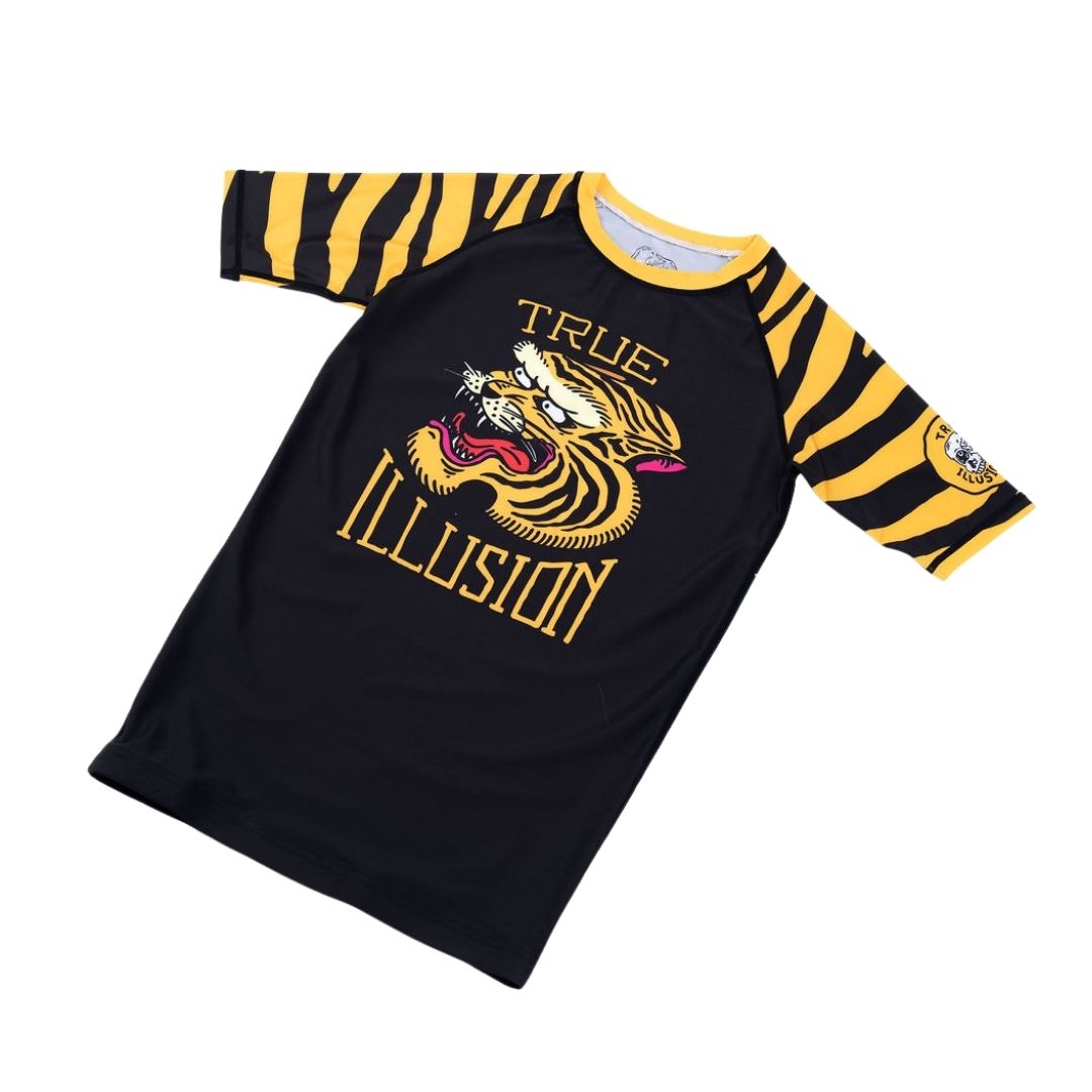 True Illusion Short Sleeve BJJ Rash Guard - Tiger, front flat lay showing roaring tiger chest graphic and black-and-gold