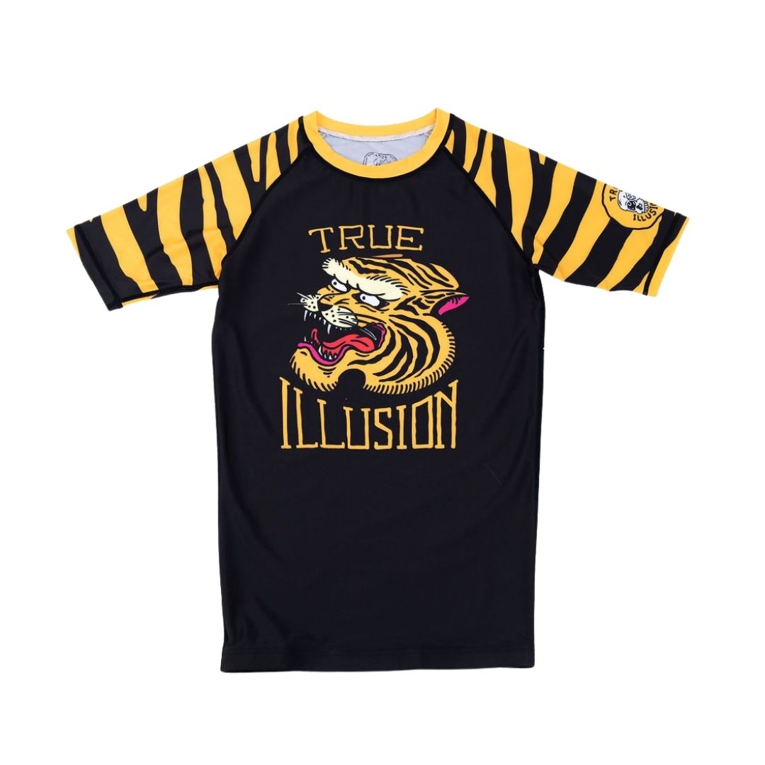 True Illusion Short Sleeve BJJ Rash Guard - Tiger, front flat lay showing black body, gold tiger-stripe sleeves, and chest