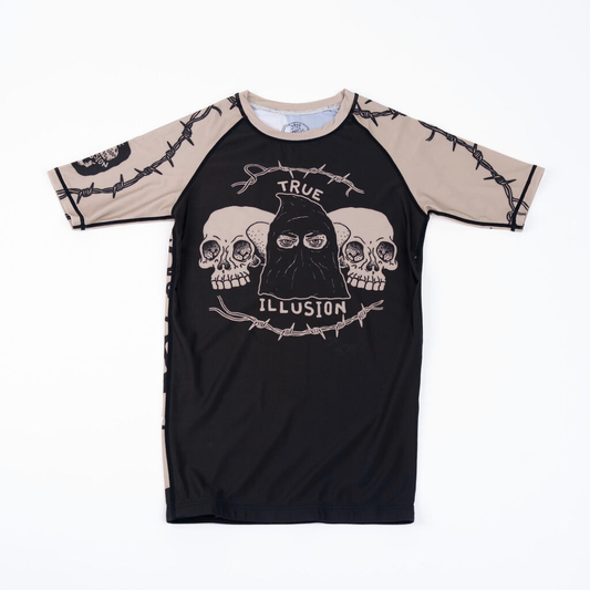 True Illusion Executioner Short Sleeve BJJ Rash Guard, front flat lay, black body with tan raglan sleeves featuring barbed