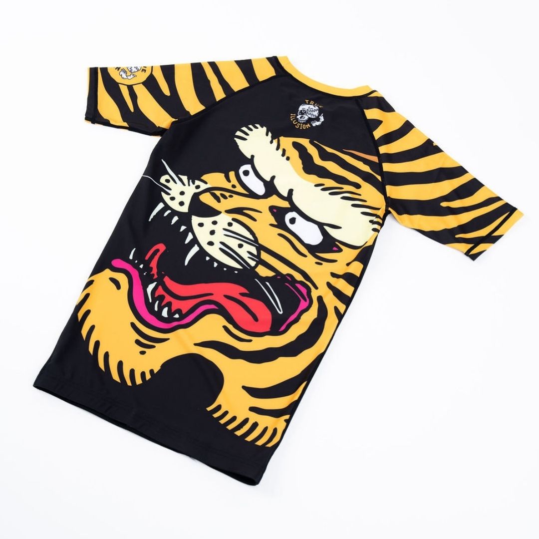 True Illusion Short Sleeve BJJ Rash Guard - Tiger, back view flat lay showing roaring tiger graphic in black and gold stripe